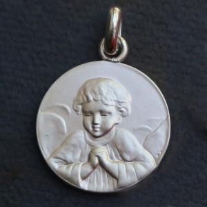 Médaille baptême ange gardien en argent.